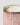 Close-up of a pink fluted mercury candle jar with metallic rose-gold speckles, a white wax fill, and a silver-toned rim on a light gray background.