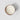 Top-down view of a round white candle in a rose gold mercury glass container with a scalloped rim, set against a light gray background with a soft shadow.