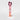 A tall, narrow pink box for Petra Living 'ADORE' Mon Amour Travel Spray, standing upright on a light gray background with a dark burgundy tissue peeking out from the top.