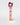 A tall, narrow pink box for Petra Living 'ADORE' Mon Amour Travel Spray, standing upright on a light gray background with a dark burgundy tissue peeking out from the top.