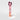 A tall, narrow pink box for Petra Living ADORE Mon Amour Travel Spray, standing upright on a light gray background with a dark burgundy tissue peeking out from the top.