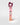 A tall, narrow pink box for Petra Living ADORE Mon Amour Travel Spray, standing upright on a light gray background with a dark burgundy tissue peeking out from the top.