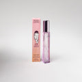 Pink perfume bottle and packaging with 'Petra Living' branding on a light gray background