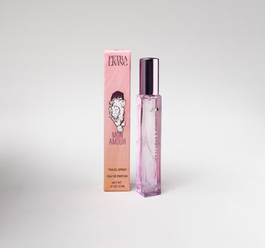Pink perfume bottle and packaging with 'Petra Living' branding on a light gray background
