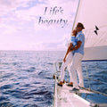 Couple embracing on a sailboat with 'Life's Beauty' text and product placement.