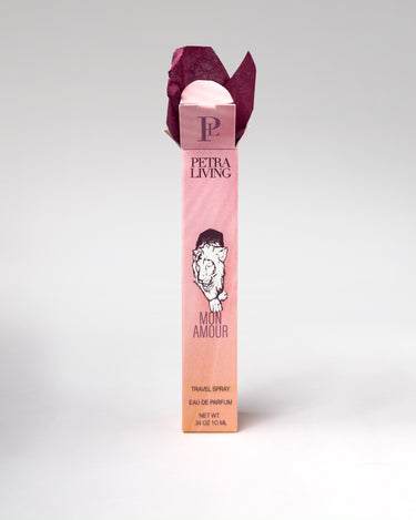 Petra Living Mon Amour perfume bottle with pink packaging on a white background