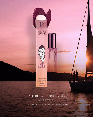 Petra Living perfume bottle with a sailboat and sunset in the background