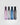 Four rectangular perfume travel spray bottles standing upright on a light gray background. From left to right, the bottles are adore in translucent pink, leather noir in clear with white lettering, trackside in blue, and rickhouse in dark gray/black.