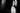 Black and white close-up of a woman and a man with dramatic lighting