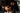 Two people embracing with a blurred background