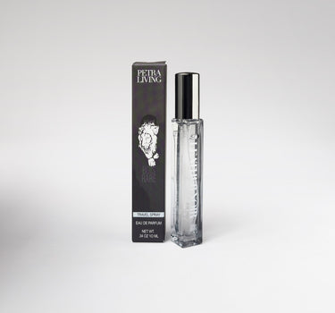 Perfume bottle and packaging with 'Petra Living' branding on a white background