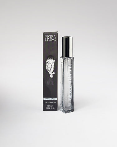Perfume bottle and packaging with 'Petra Living' branding on a white background