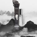 Petra Living Leather Noir perfume bottle and packaging against a mountainous background
