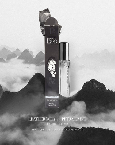 Petra Living Leather Noir perfume bottle and packaging against a mountainous background