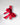 Red gift box en rouge with a large bow on a light gray background