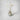 Parasol diffuser in antique glass green vase with white reeds and preserved flowers
