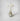 Parasol diffuser in antique glass green vase with white reeds and preserved flowers