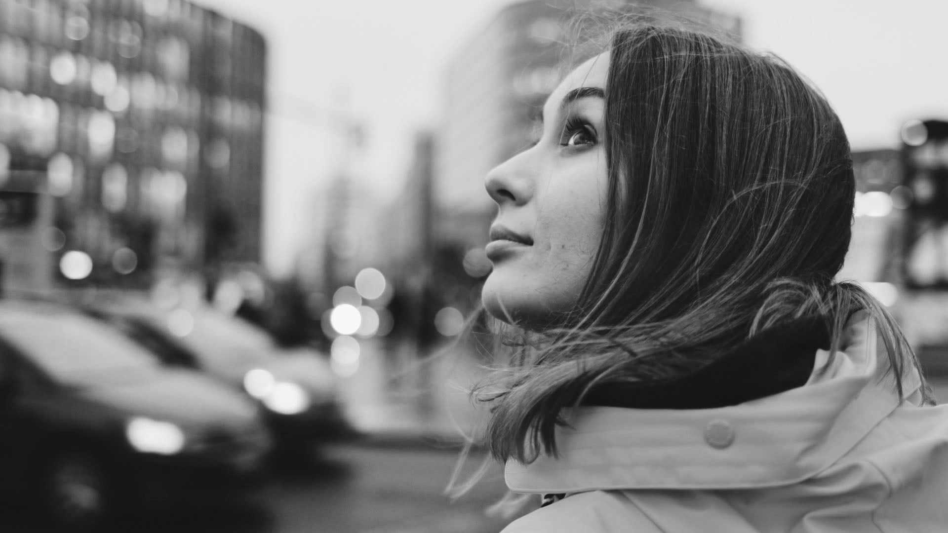 Black and white photo of a woman in an urban setting