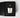 A Petra Living 'Rickhouse' petite votive scented candle in a clear glass jar, nestled inside its textured black presentation box with a matching black label.