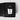 A Petra Living 'Rickhouse' petite votive scented candle in a clear glass jar, nestled inside its textured black presentation box with a matching black label.