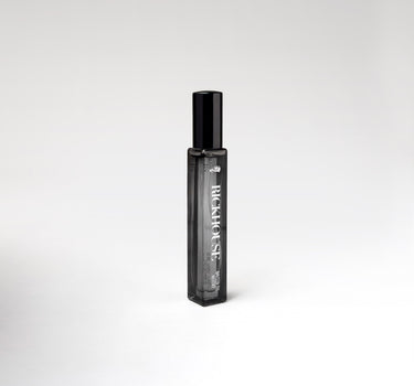 Black perfume bottle with 'Rickhouse' branding on a white background