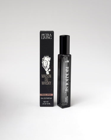 Perfume bottle and packaging with 'Petra Living' branding on a white background