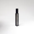 Black perfume travel spray on white background