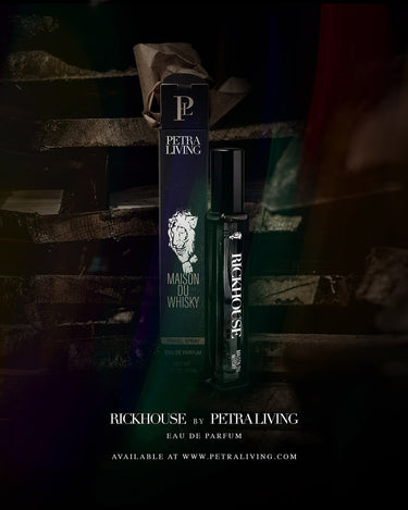 Petra Living Rickhouse perfume bottle and packaging on a dark wooden background