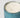 A close-up of a three-wick trackside soleil del mar candle in a ribbed mercury, vertically fluted glass container with a distressed blue finish, filled with creamy off-white natural wax, set against a plain light gray background.