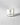 Clear candle in a glass container with a label on a light gray background petite bougie votive