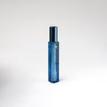 Blue perfume bottle on a white background