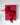red gift box en rouge with a bow on a light gray background